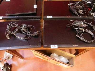 a lot of laptops that are sitting on a table