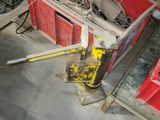 a red box with tools and a fan in a garage