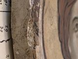 a picture of a woman on the wall of a house