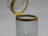 an image of a glass jar with a gold lid on a white background
