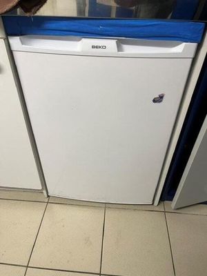 a white dishwasher sitting in a kitchen next to a counter