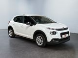 a white citrole is parked in a white room