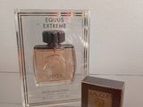 an image of a bottle of perfume next to a box of perfume