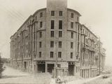 a black and white photo of a building that is under construction