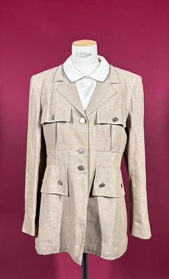 an image of a beige jacket on a mannequin stand