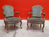 pair of antique chairs with upholstered upholstered arms
