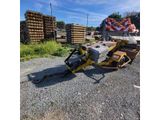 the back end of a tractor with a load of lumber in the back