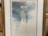 tableau représentant une femme en robe blanche et chapeau, posé sur un chevalet