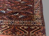 an image of a large oriental rug on a grey background