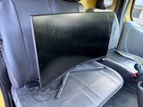 a television in the back seat of a car