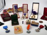 many medals and medals on display on a table