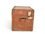 an old suitcase with a tag on it sitting on a white surface