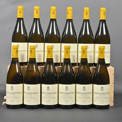a bunch of bottles of wine sitting in a wooden crate