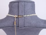 a close up of a necklace on a mannequin neck