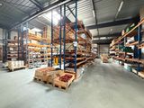 a large warehouse filled with lots of shelves and pallets