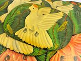 three placemats with birds on them on a white surface