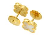 a close up of a pair of gold plated cufflinks