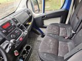 a view of the inside of a bus with the driver ' s seat up