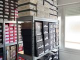 many boxes stacked on top of each other in a room