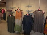 a lot of clothes on display in a store