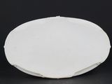an image of a white porcelain bowl on a black background