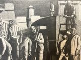 drawing of a group of men carrying a large piece of wood