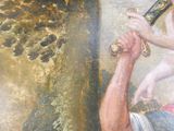 un tableau représentant une femme tenant un bébé et une batte de baseball