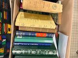a box full of books sitting on top of a table