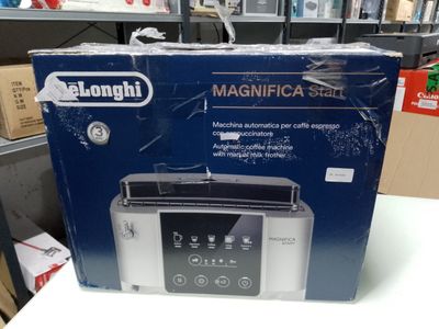 the box of a toaster is sitting on a table in a store