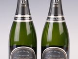 pair of bottles of laurent perrier brut - brut sparkling wine