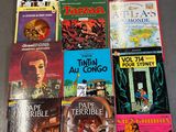 un grand nombre de livres posés sur une table