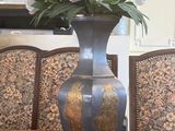 a vase with flowers in it sitting on a table