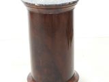 a small wooden table with a marble top on a white background
