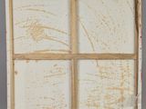 painting of four panes of white paint on a gray surface