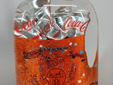 bottle of soda with a handle and a handle on top of it