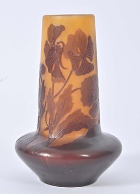 a vase that has a brown and yellow design on it
