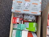 a box of assorted items sitting on the ground