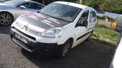 a white van parked in a parking lot next to other cars