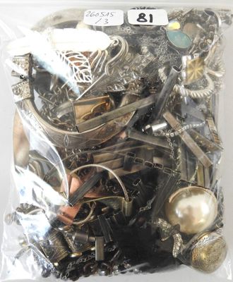 a bag full of assorted silver and gold jewelry