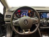 the interior of a car with a steering wheel and dashboard controls