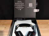 a box with a pair of headphones in it sitting on a table