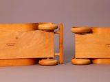 two pieces of wood sitting on top of each other