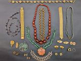 a collection of jewelry including necklaces, bracelets, and rings