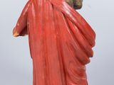 an image of a statue of a woman in a red dress