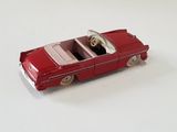 a toy car that is sitting on a white surface