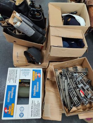 several boxes of assorted items sitting on the floor in a room