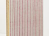 an image of a red and white striped book on a white surface