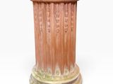a close up of a vase on a white surface with a white background