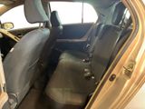 the back seat of a car with the door open and a seat belt down