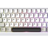 a computer keyboard that has a white key board on it